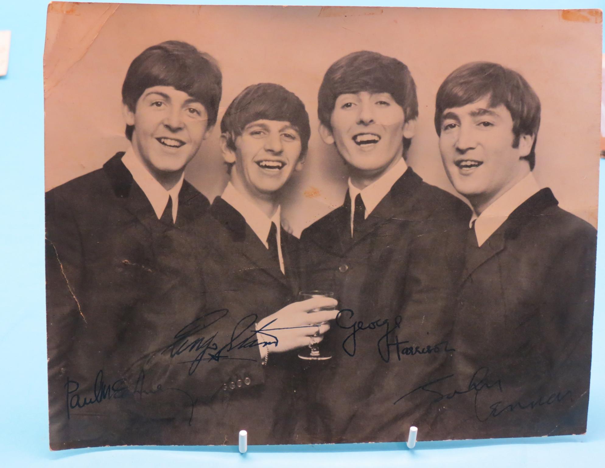 Appraisal: The Beatles - group photograph bearing signatures and another without