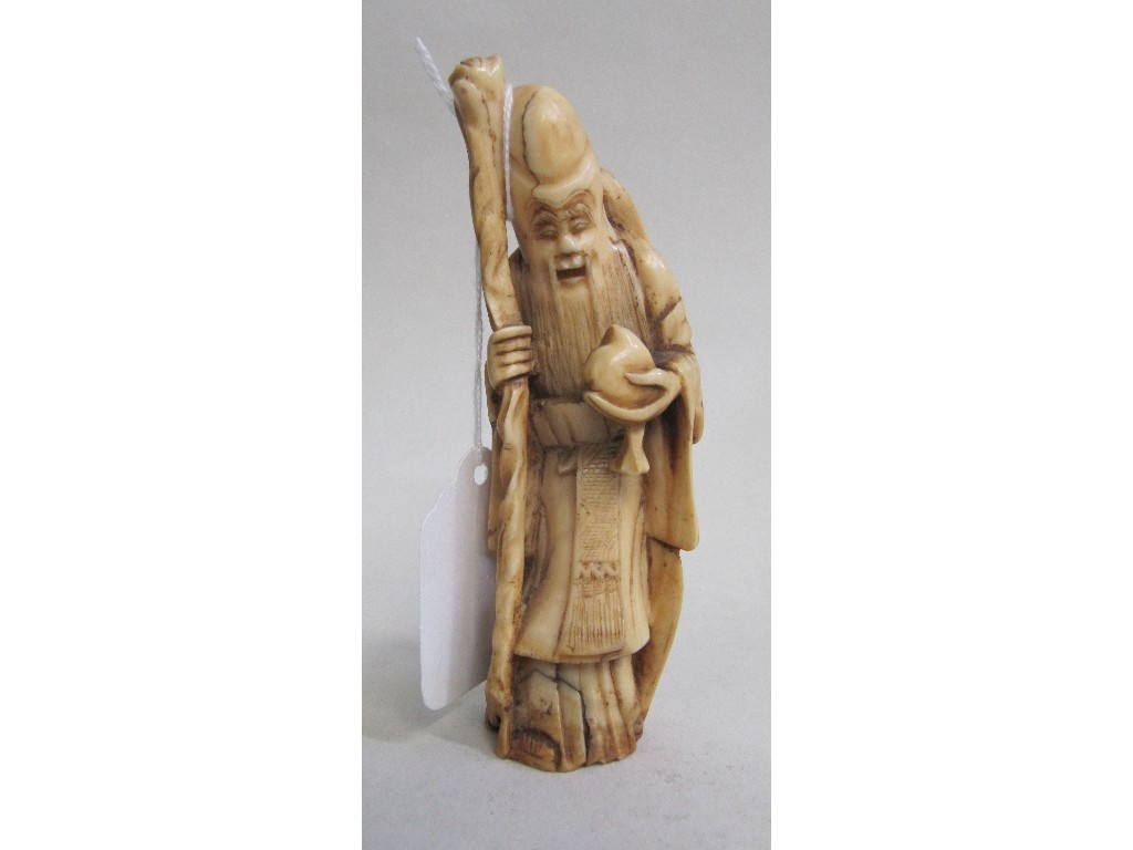 Appraisal: Carved ivory figure of a Japanese God