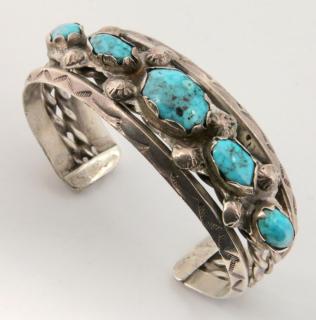 Appraisal: NAVAJO STERLING SILVER CUFF BRACELET WITH TURQUOISE Five turquoise cabochons