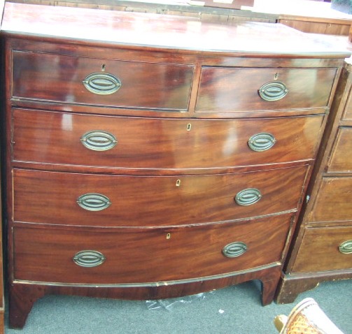 Appraisal: An early th century mahogany bowfront chest of two short