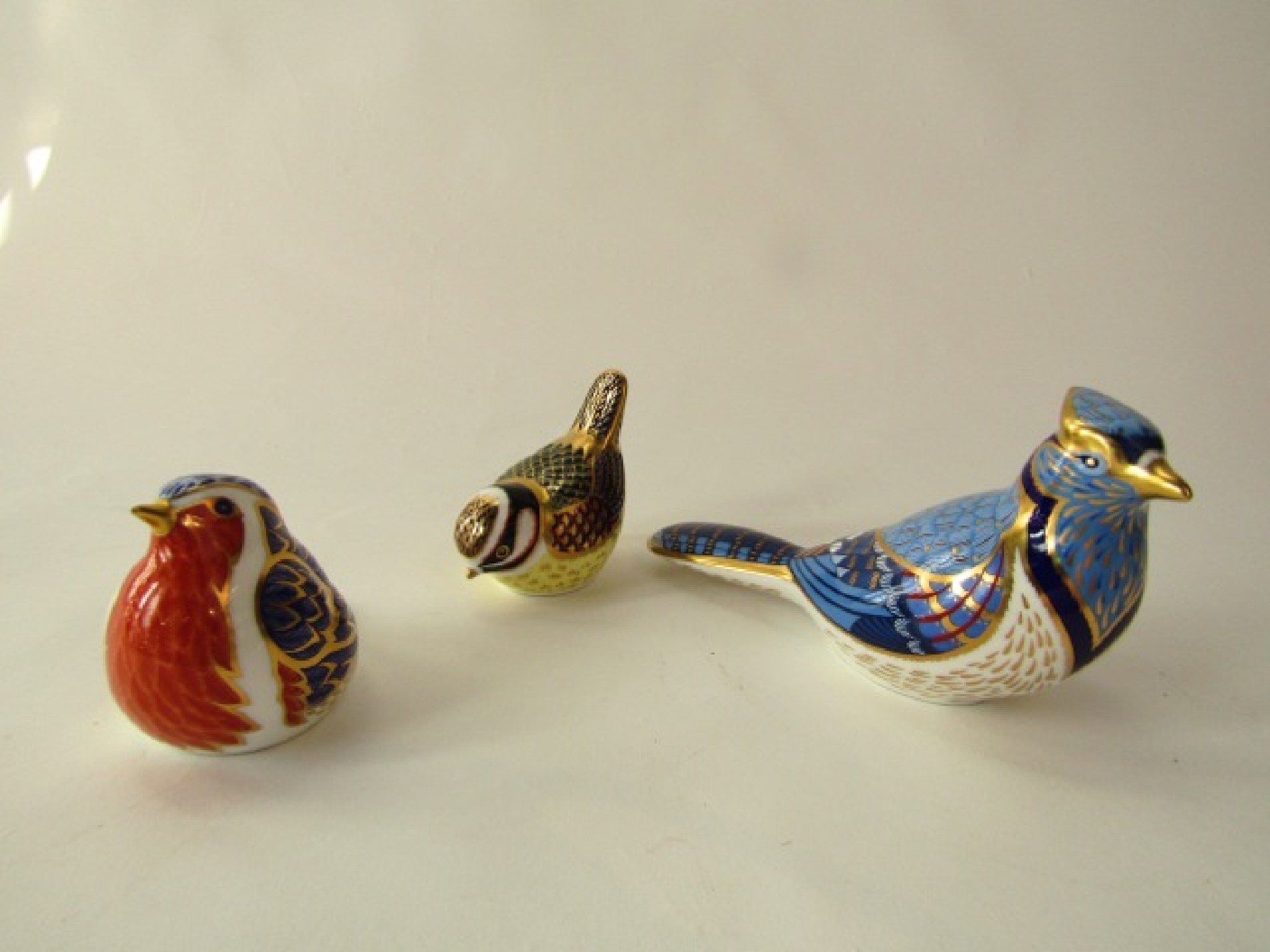 Appraisal: A collection of three Royal Crown Derby paperweights in the