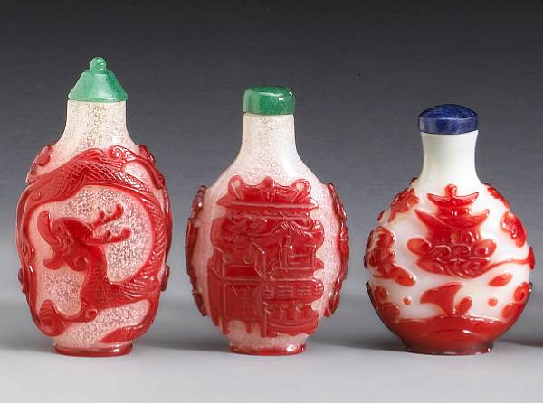 Appraisal: Three glass snuff bottles with overlay decoration Late Qing Early