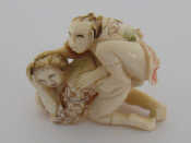 Appraisal: An early th century Japanese carved ivory erotic netsuke carved