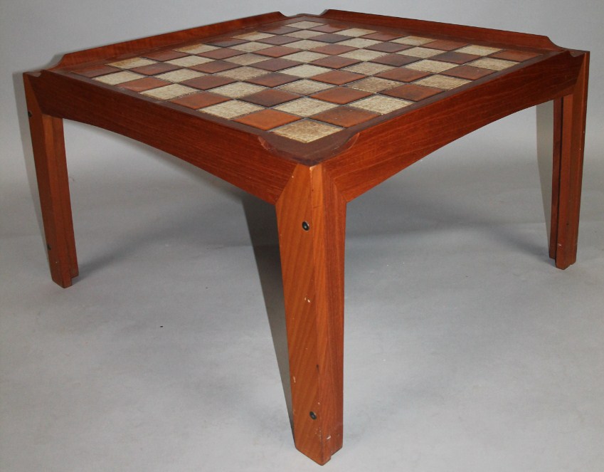 Appraisal: A 's teak framed coffee table with a tile centre