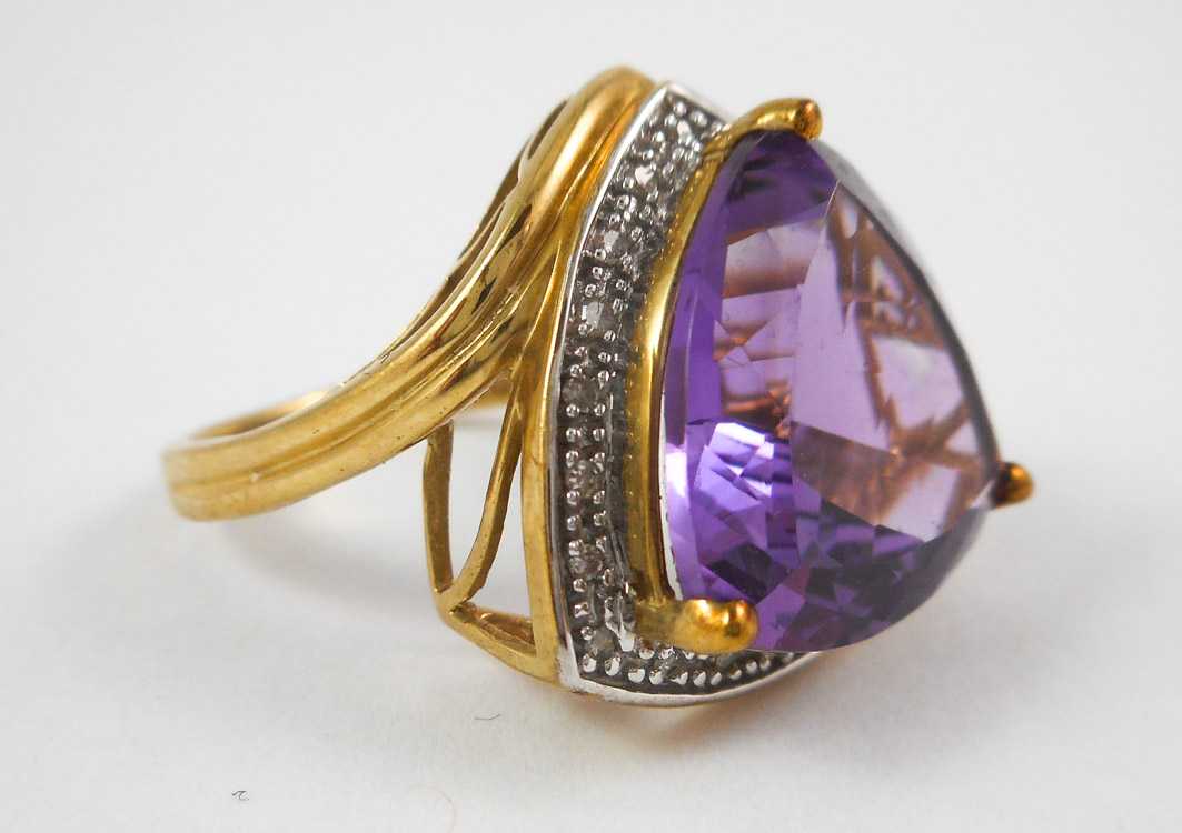 Appraisal: AMETHYST DIAMOND AND TEN KARAT GOLD RING with round-cut diamonds