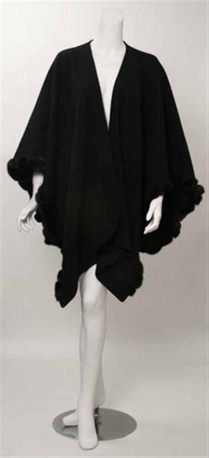 Appraisal: Two black wool fur trimmed shawls One with dark mink