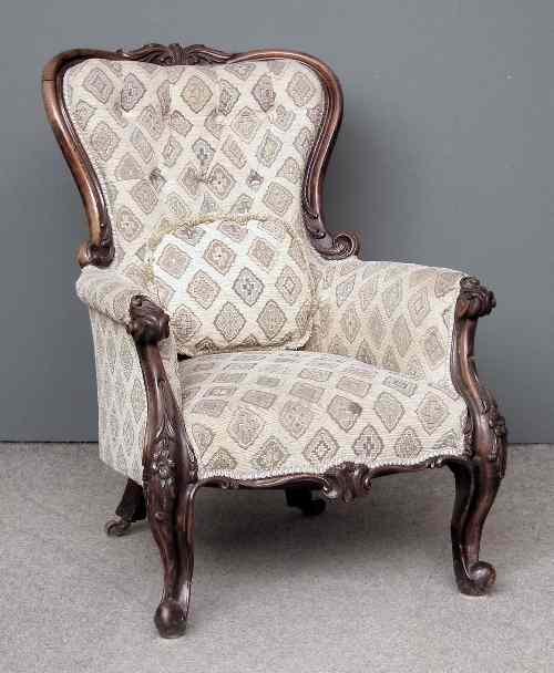 Appraisal: A Victorian mahogany showwood framed spoon back easy chair the