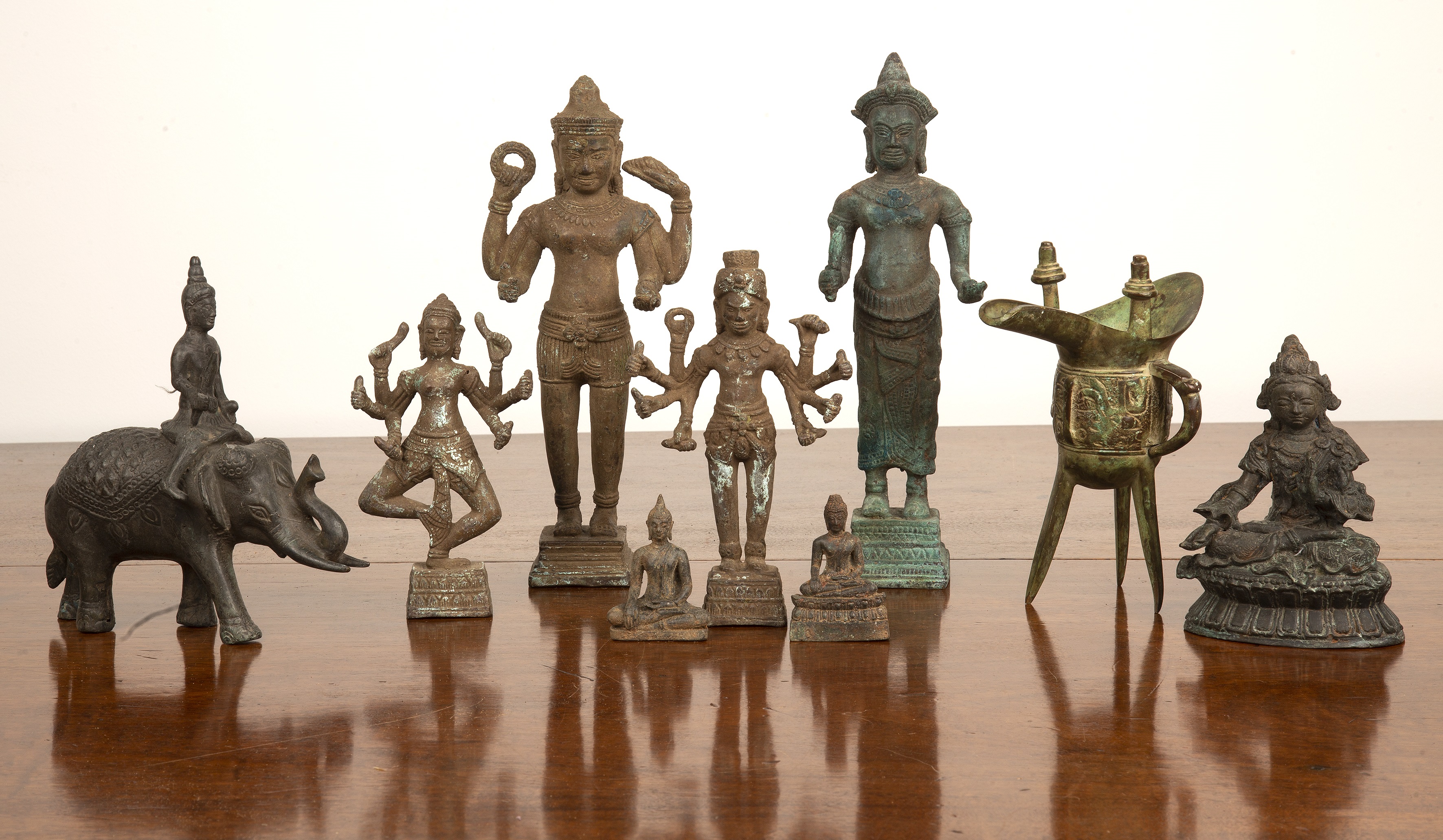 Appraisal: Nine Chinese cast metal figuresafter the originals to include a