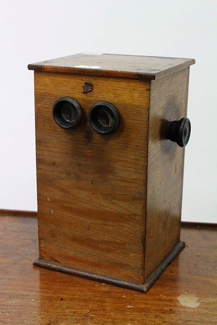 Appraisal: AN ANTIQUE WOODEN CASED STEREOSCOPIC VIEWER and glass slides with