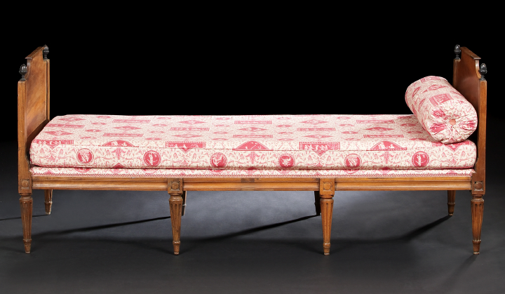 Appraisal: Provincial Directoire-Style Walnut Daybed early th century the cushioned rectangular