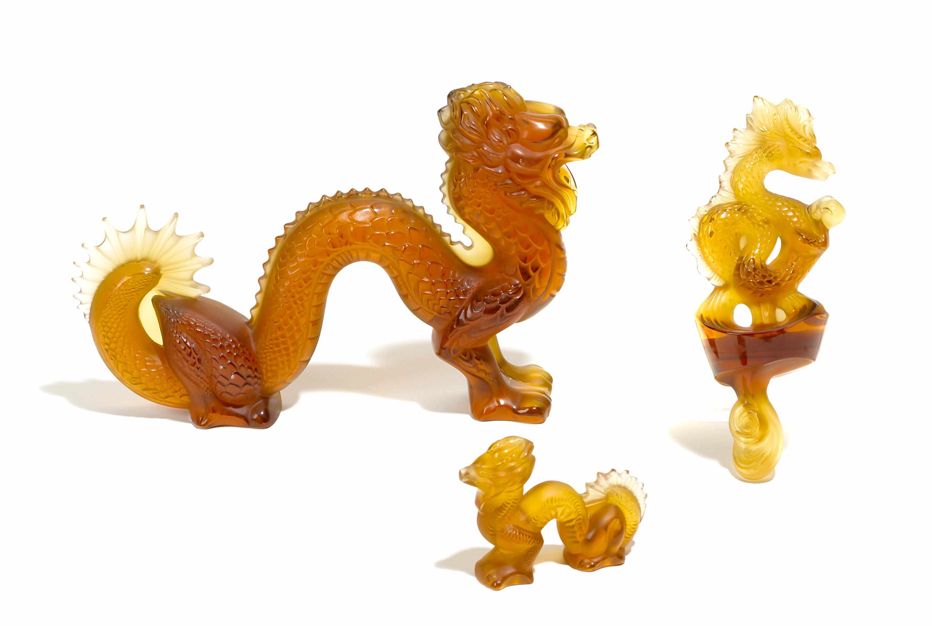 Appraisal: A Lalique large amber glass dragon a small amber glass