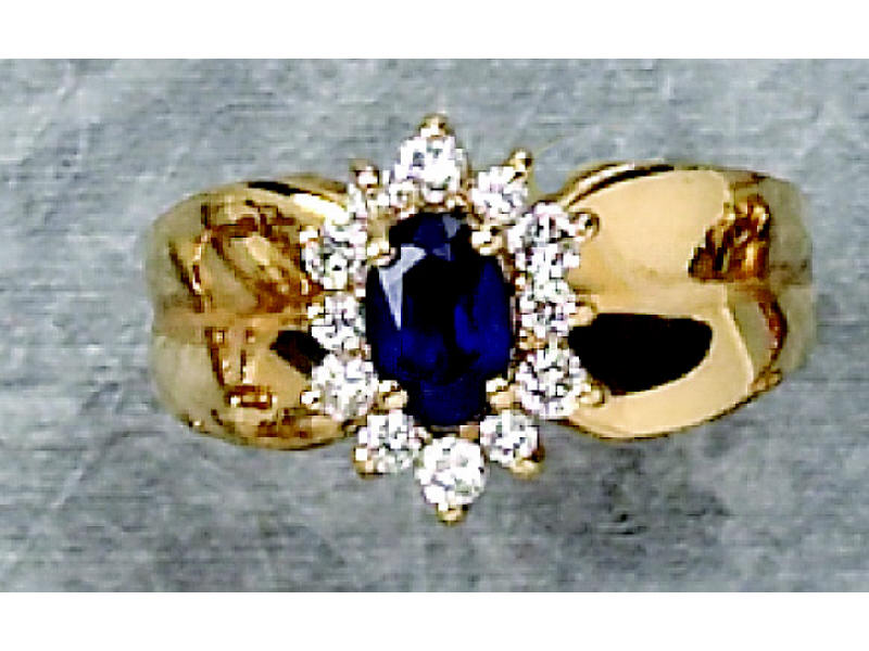 Appraisal: SAPPHIRE AND DIAMOND RING k yellow gold ring set with