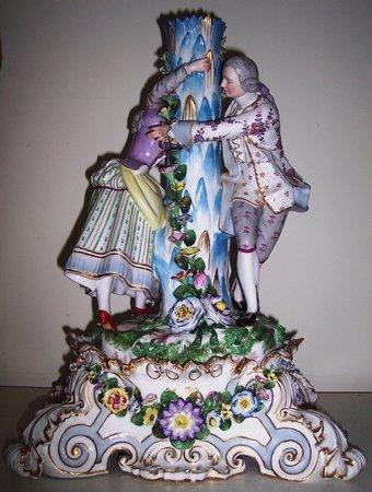 Appraisal: A Meissen figural comport base the floral encrusted column with