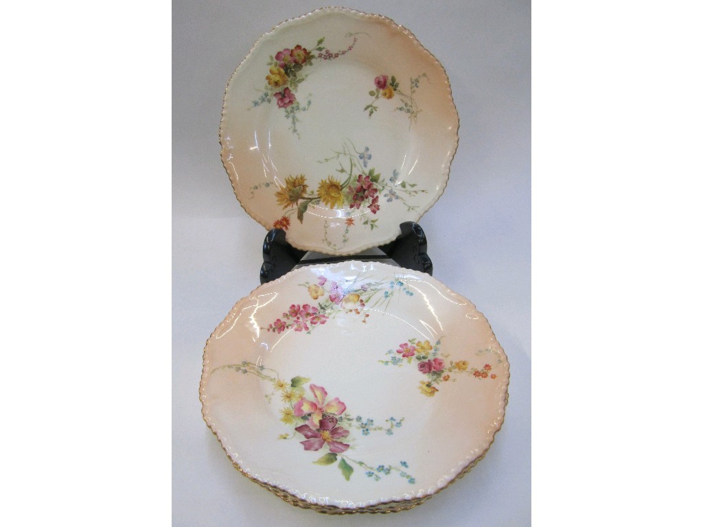 Appraisal: Four Royal Worcester plates decorated with flowers on a blush