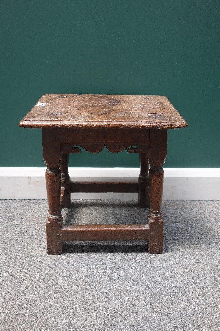 Appraisal: A late th oak joint stool with shaped frieze on