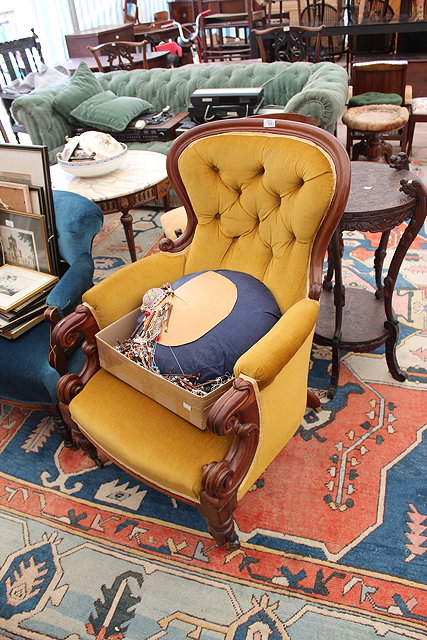 Appraisal: A VICTORIAN MAHOGANY FRAMED ARMCHAIR with yellow button back upholstered