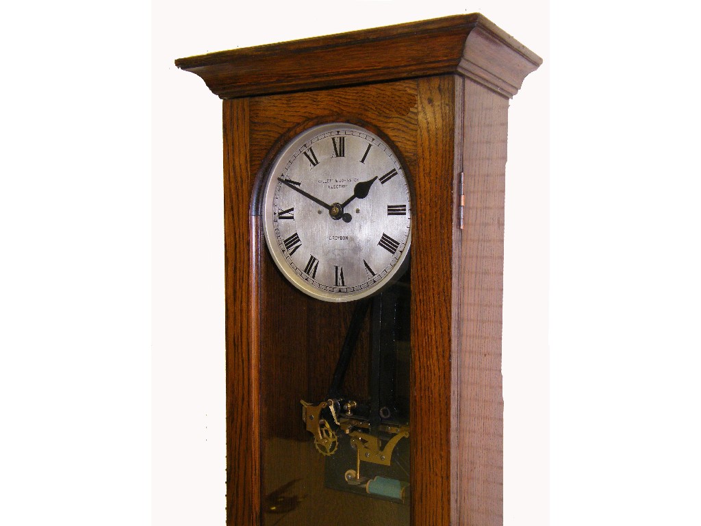 Appraisal: Gillett Johnston electric master clock the silvered dial within an