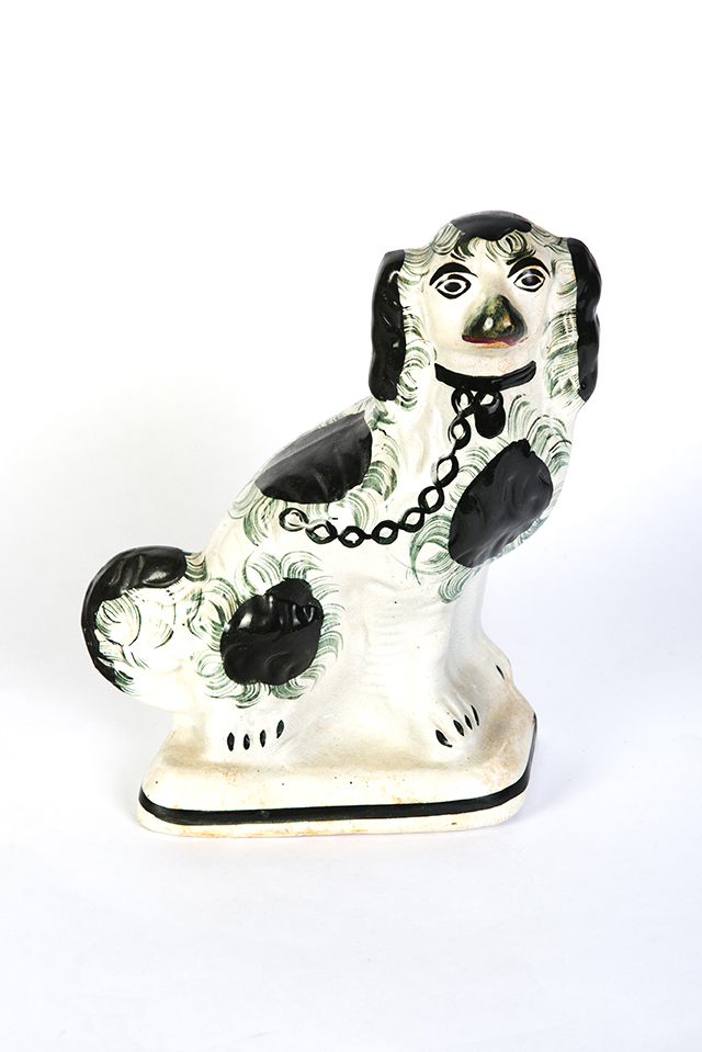 Appraisal: STAFFORDSHIRE SPANIEL England mid th century Hollow body black spots