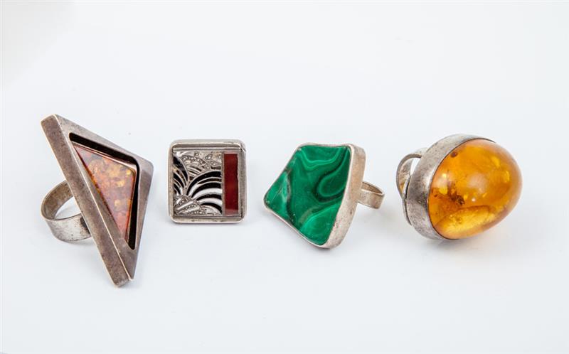 Appraisal: GROUP OF FOUR SILVER-MOUNTED FINGER RINGS Variously fitted with malachite