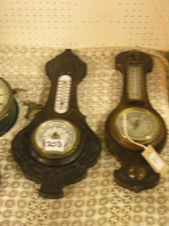 Appraisal: Two oak cased aneroid barometers each with thermometer dial in