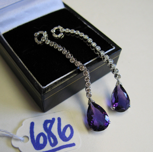 Appraisal: PAIR OF AMETHYST DIAMOND AND EIGHTEEN KARAT WHITE GOLD PENDANT