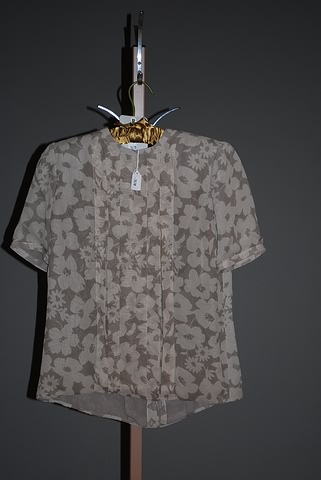 Appraisal: Andr Laug short sleeve silk blouse with brown floral print