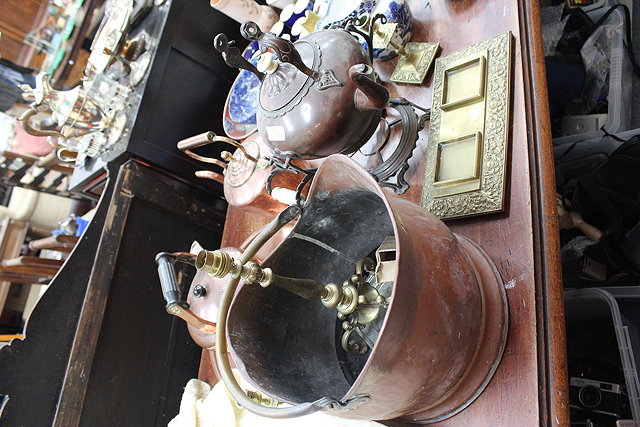 Appraisal: A COPPER COAL SCUTTLE A PAIR OF BRASS CANDLESTICKS and