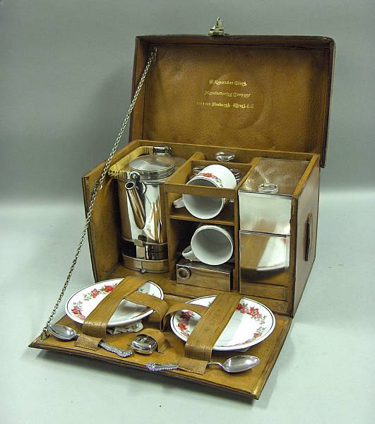 Appraisal: A honey leather cased -person tea set by Alexander Clark