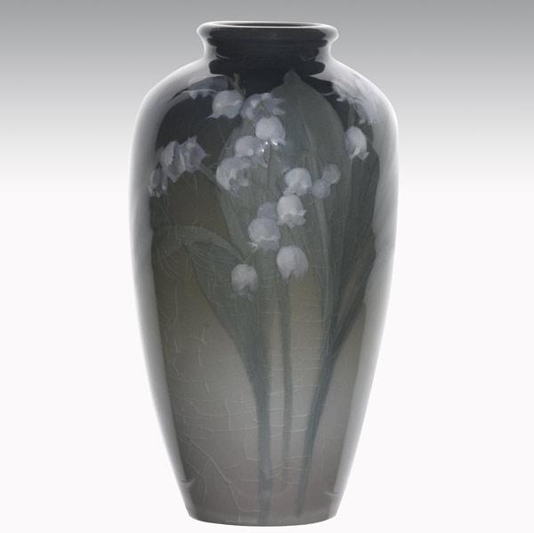 Appraisal: CAROLINE STEINLEROOKWOODIris glaze vase with lily of the valley Flame