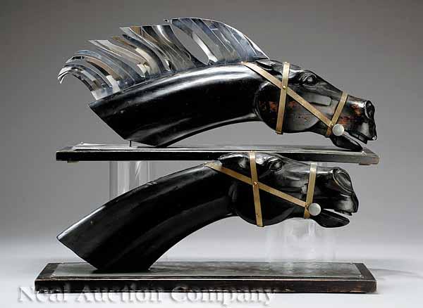 Appraisal: A Pair of Continental Ebonized Wood and Polished Metal Figures