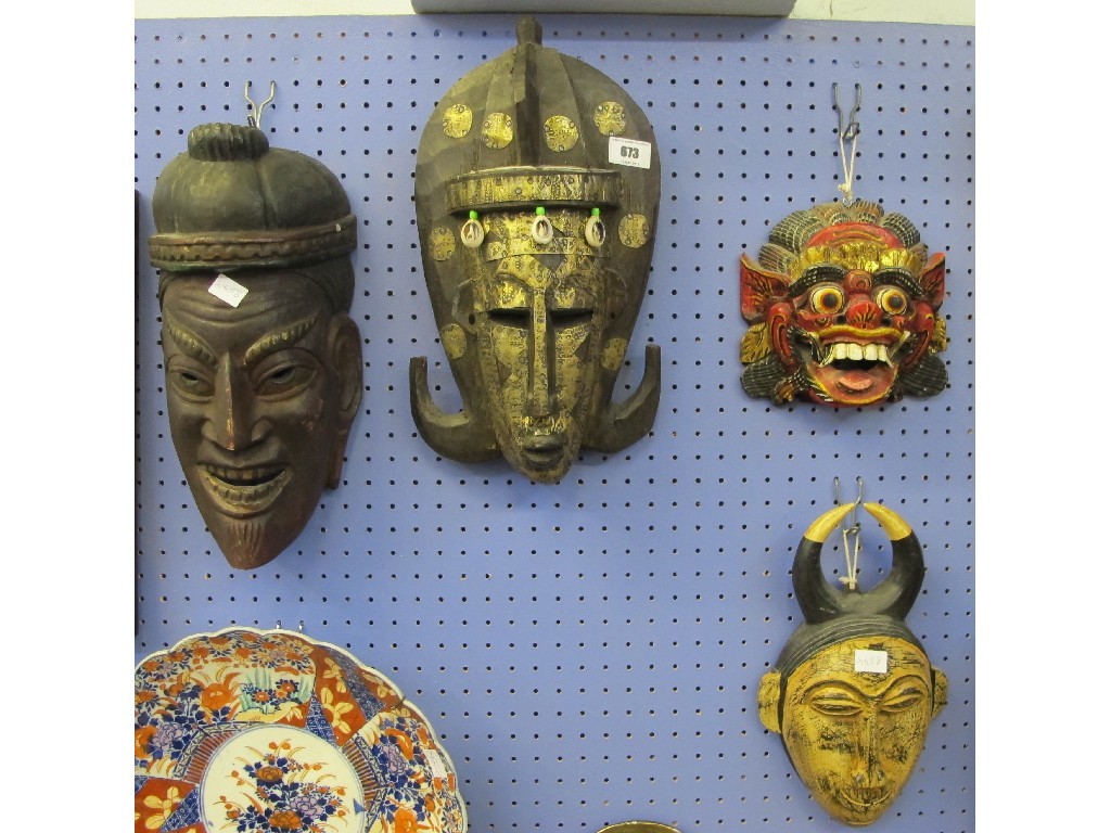 Appraisal: Four carved wooden masks