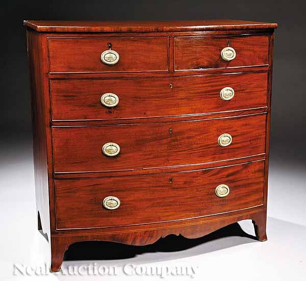 Appraisal: A Federal Mahogany Bowfront Chest of Drawers with two short