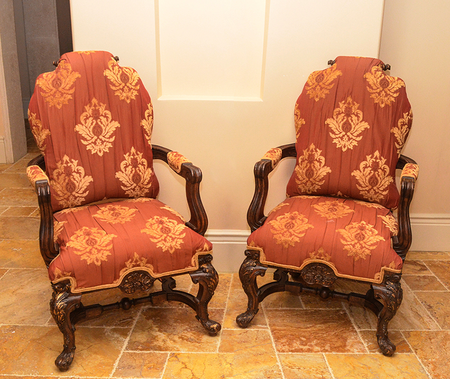 Appraisal: PAIR OF CARVED OPEN ARM PARLOR CHAIRS Top with turned