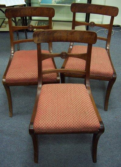 Appraisal: A set of three th Century mahogany dining chairs the