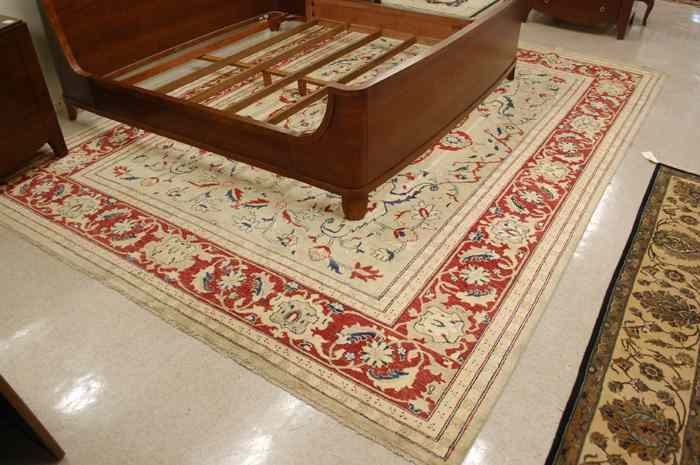 Appraisal: HAND KNOTTED ORIENTAL CARPET Pakistani-Persian floral and central floral medallion