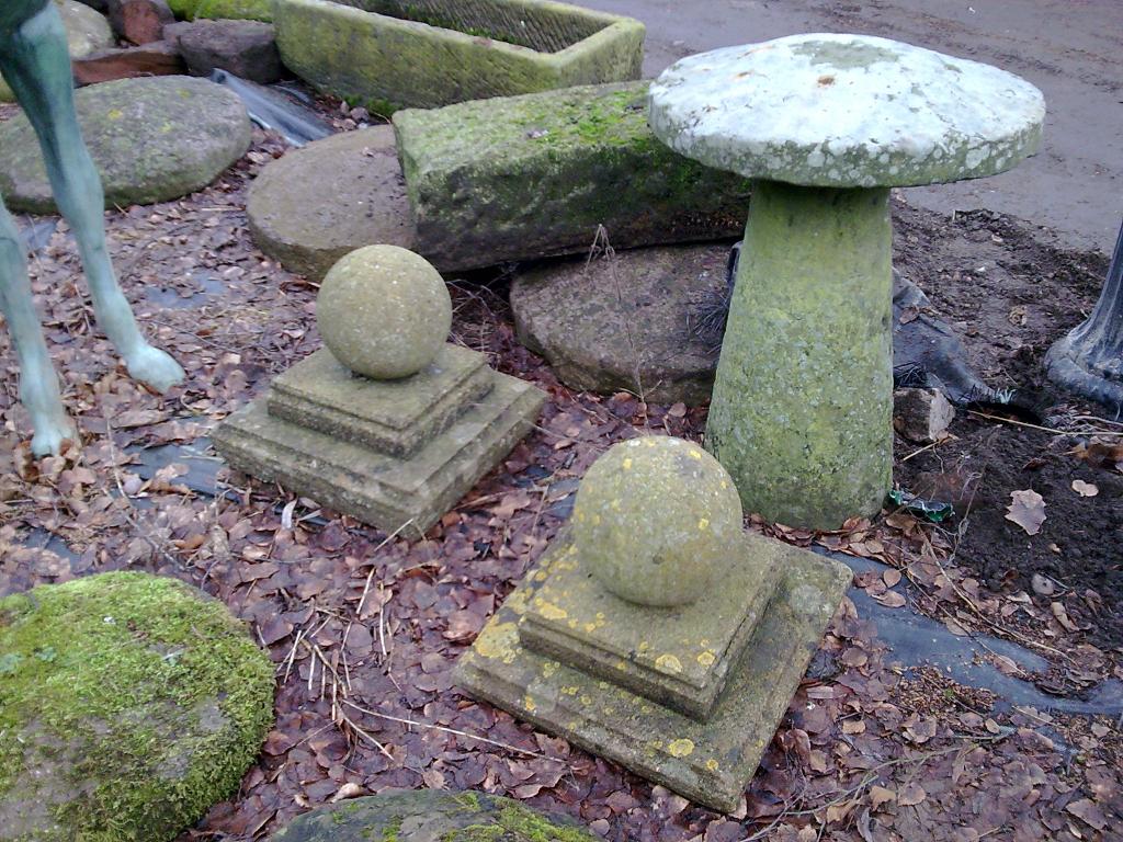 Appraisal: A pair of spherical Finials on stepped bases