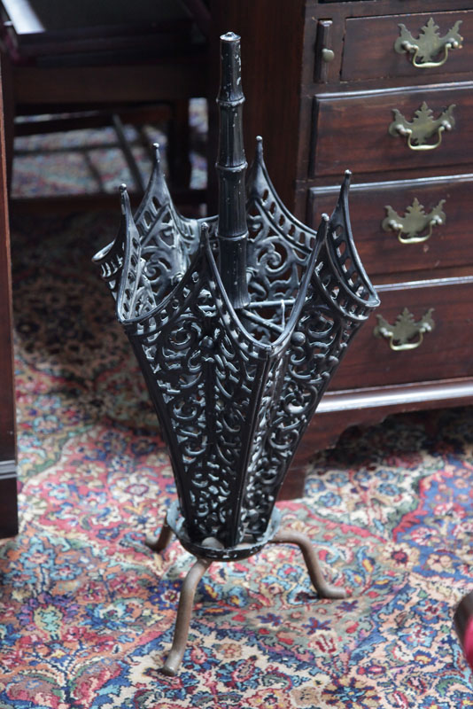 Appraisal: UMBRELLA HOLDER Cast iron openwork stand in the form of