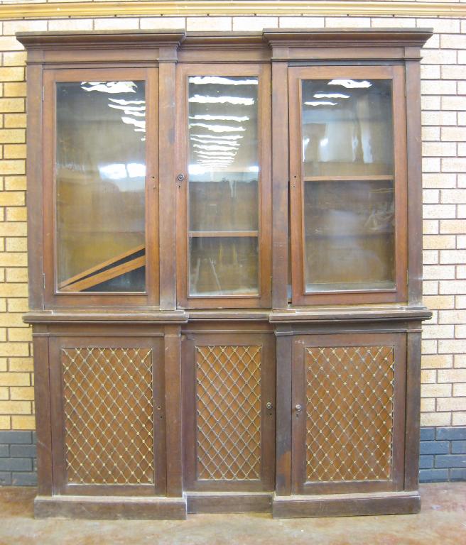 Appraisal: A th Century oak inverted breakfront Bookcase with three plain