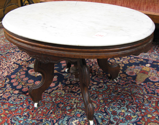 Appraisal: A VICTORIAN MARBLE-TOPPED WALNUT COFFEE TABLE American late th century