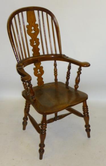 Appraisal: A YEW WINDSOR ARMCHAIR Yorkshire th century similar to the