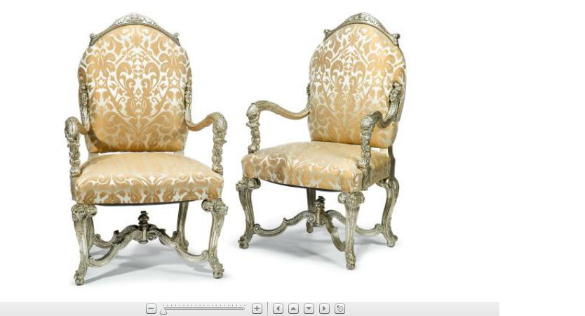 Appraisal: Pair of Italian Rococo style silvered armchairsEach with an acanthus