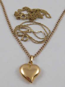 Appraisal: A yellow metal tests high carat gold heart shaped locket