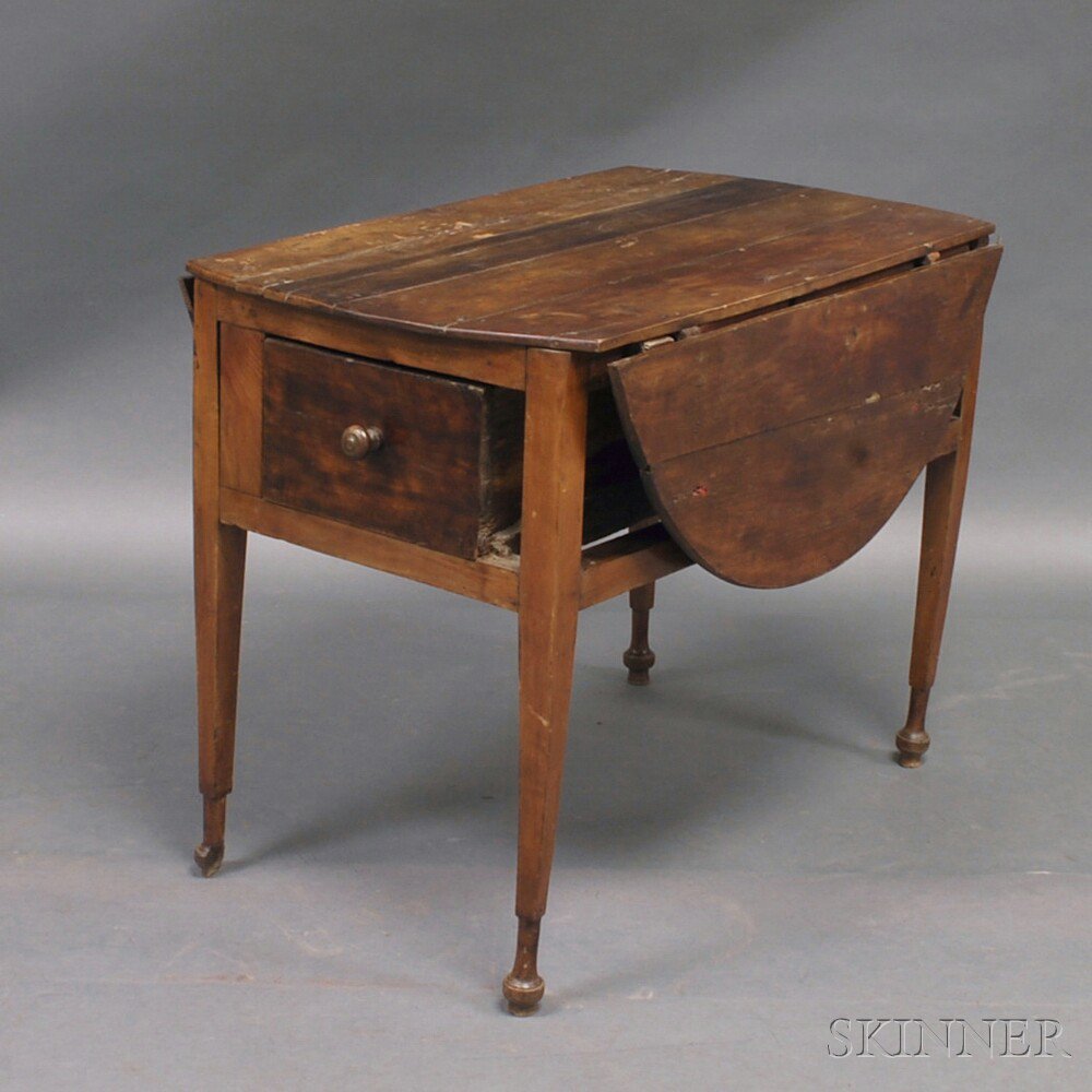 Appraisal: Continental Hardwood Drop-leaf Worktable the circular top over case with