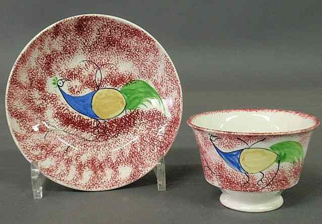 Appraisal: Peafowl red spatterware handleless cup and saucer early th c