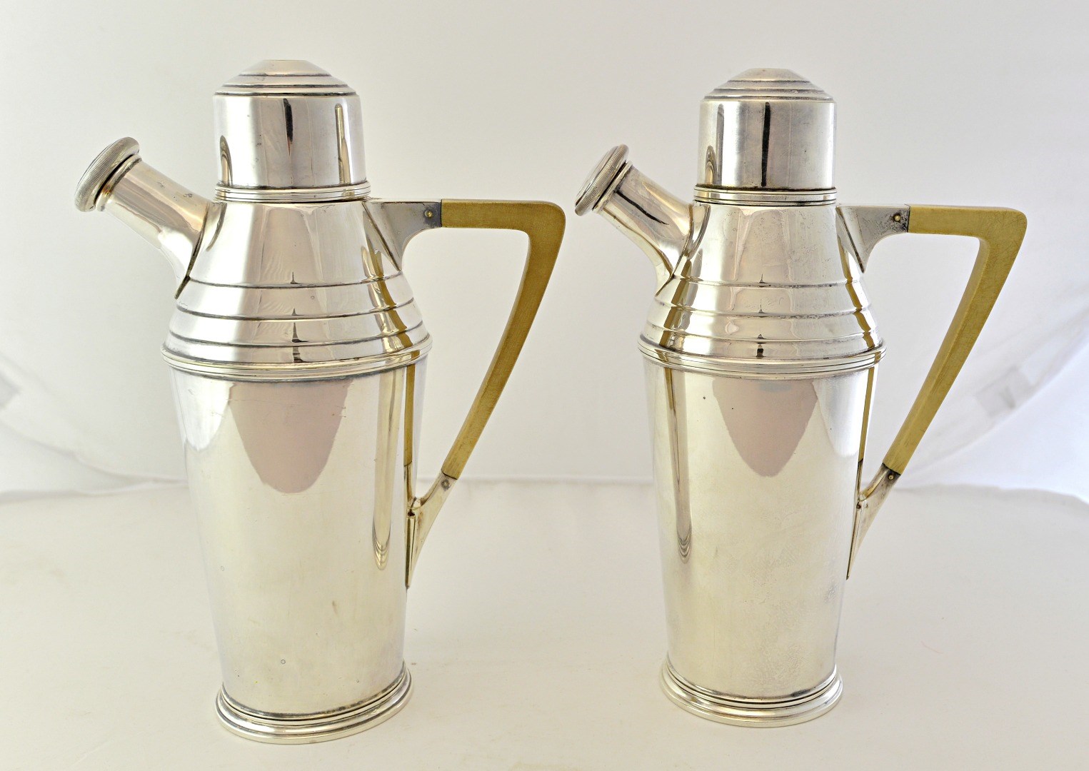 Appraisal: A pair of Harrods silver plated cocktail jugs cum shakers