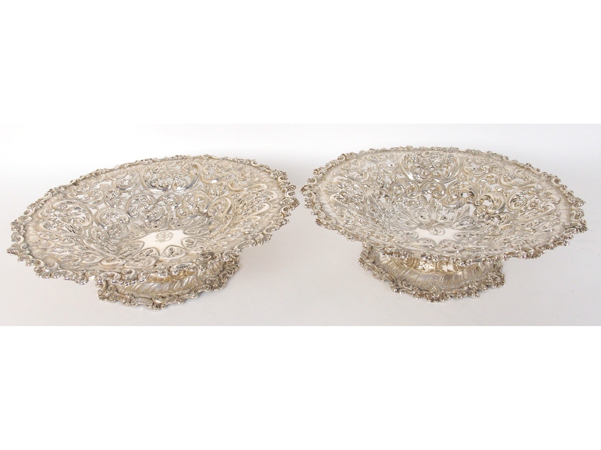 Appraisal: A pair of silver sweetmeat dishesmarked on the base Alexander