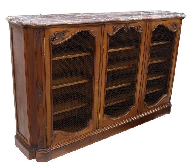 Appraisal: French walnut bookcase early th c having a shaped marble