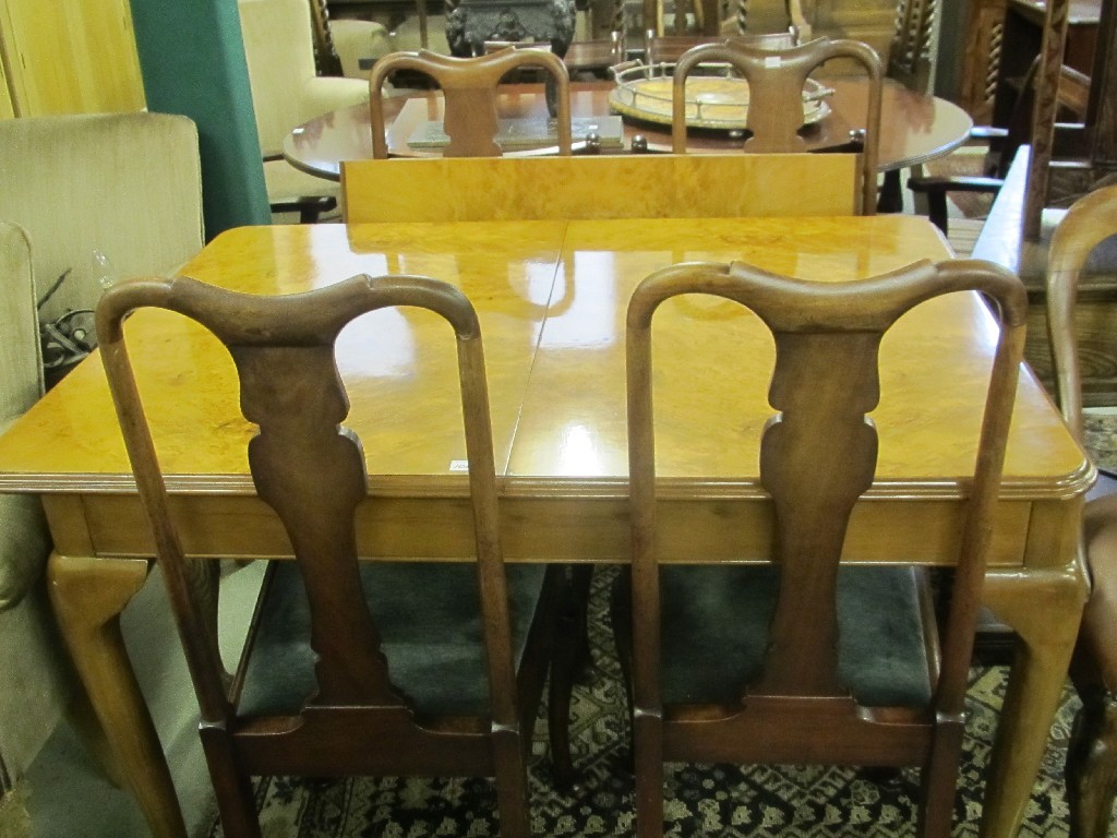 Appraisal: Walnut dining table with four Queen Anne style chairs