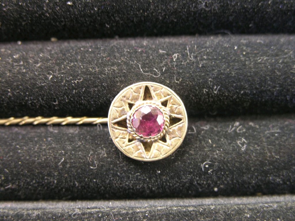 Appraisal: A Victorian stick-pin set central pink stone in original leather