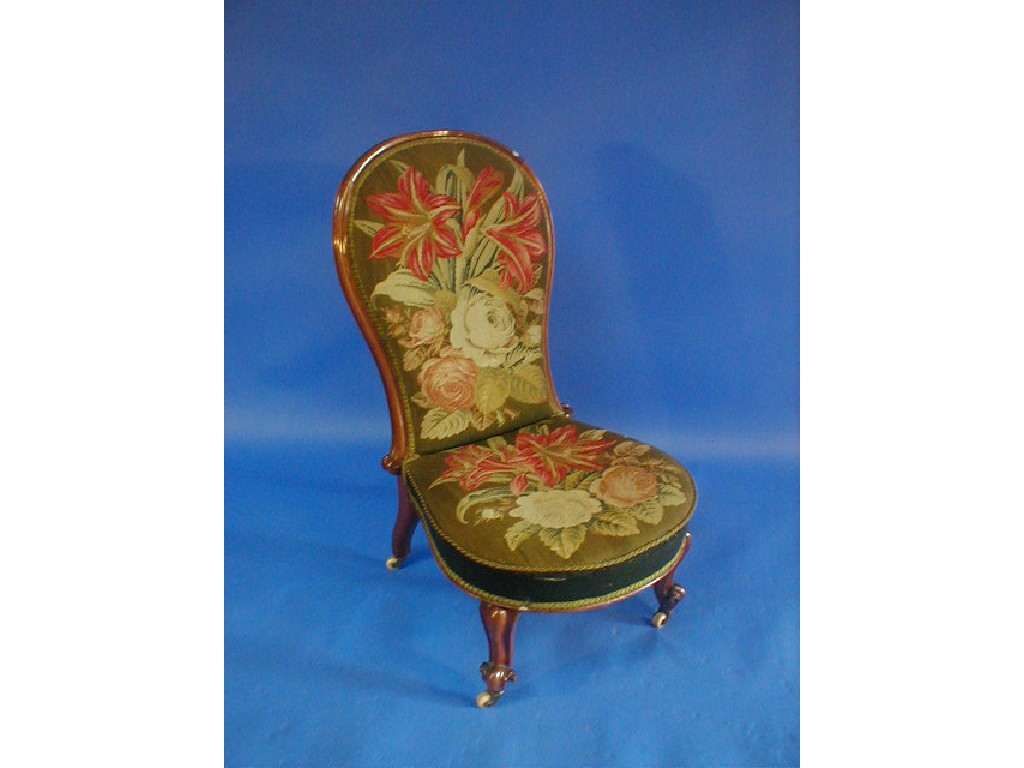 Appraisal: A Victorian mahogany spoon back nursing chair with Berlin rose